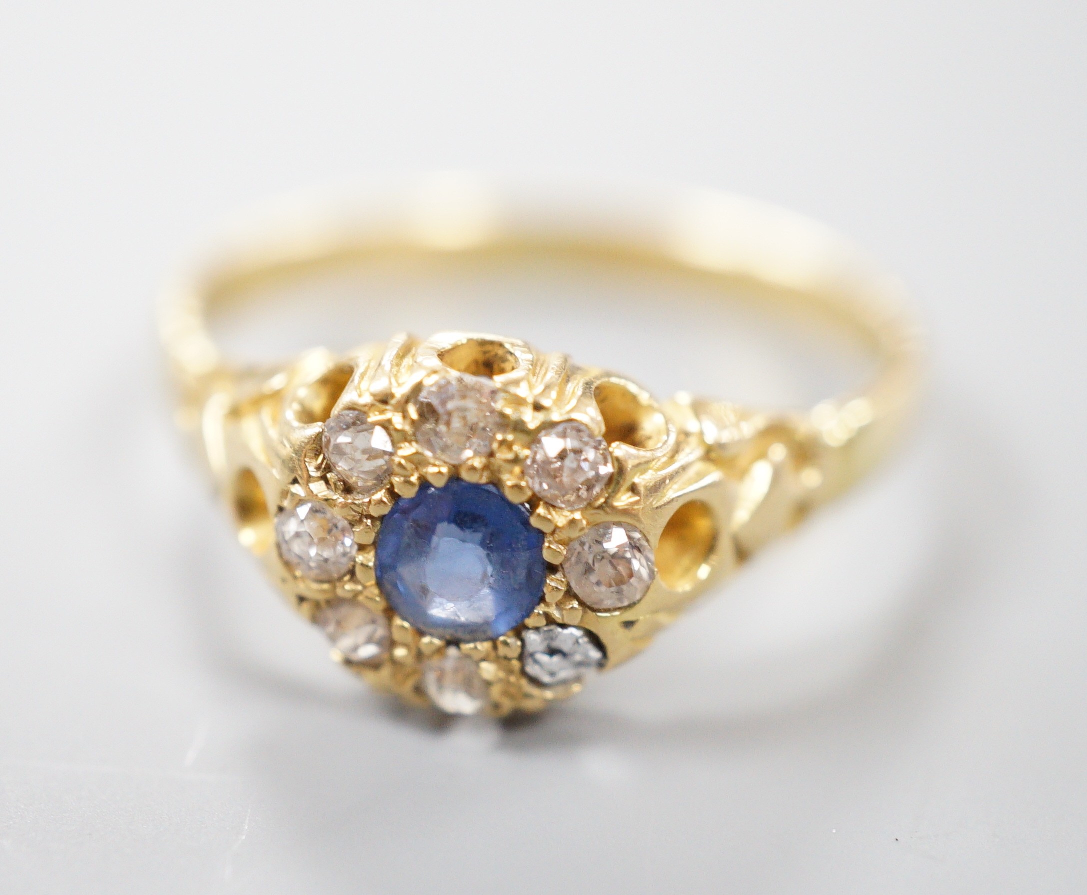 An early 20th century yellow metal, sapphire and diamond set cluster ring (stone missing), size P/Q, gross weight 3.5 grams.